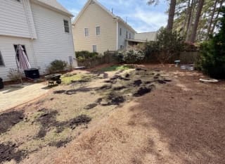 Backyard during topsoil prep and lawn repair before sod